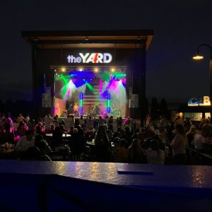 Live music conert with colorful lighting on stgae